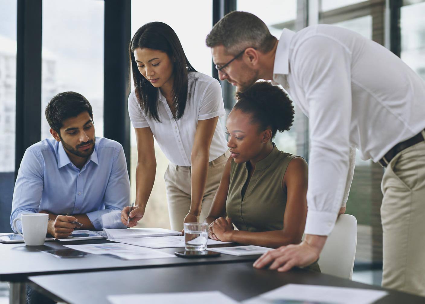 Business professionals reviewing financial reporting together